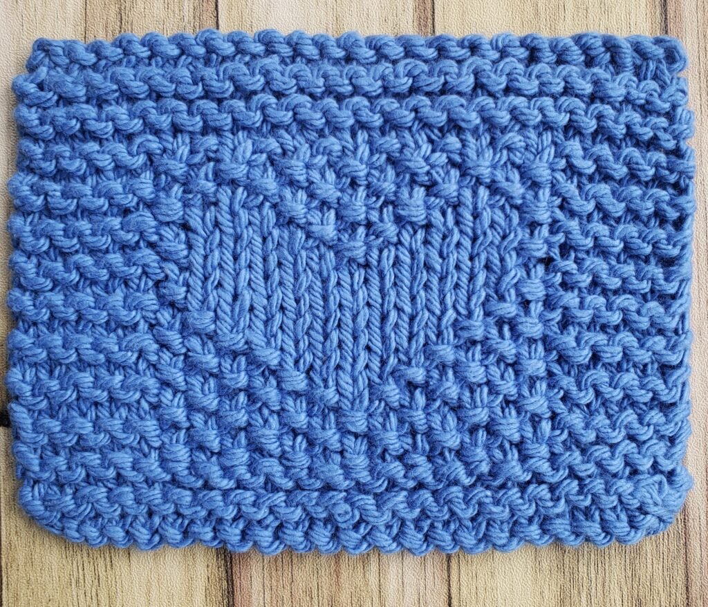 Everyday Comforts Heart Coaster: An Easy Knit Coaster Pattern for Beginners heart coaster close up